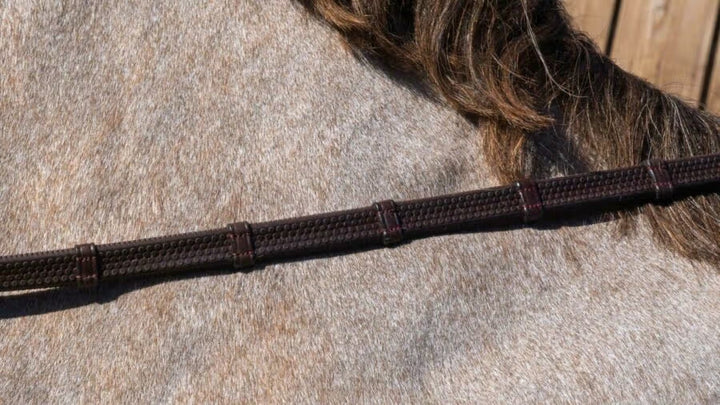 Dyon 1/2" Rubber Reins with 7 leather loops and plaited finish