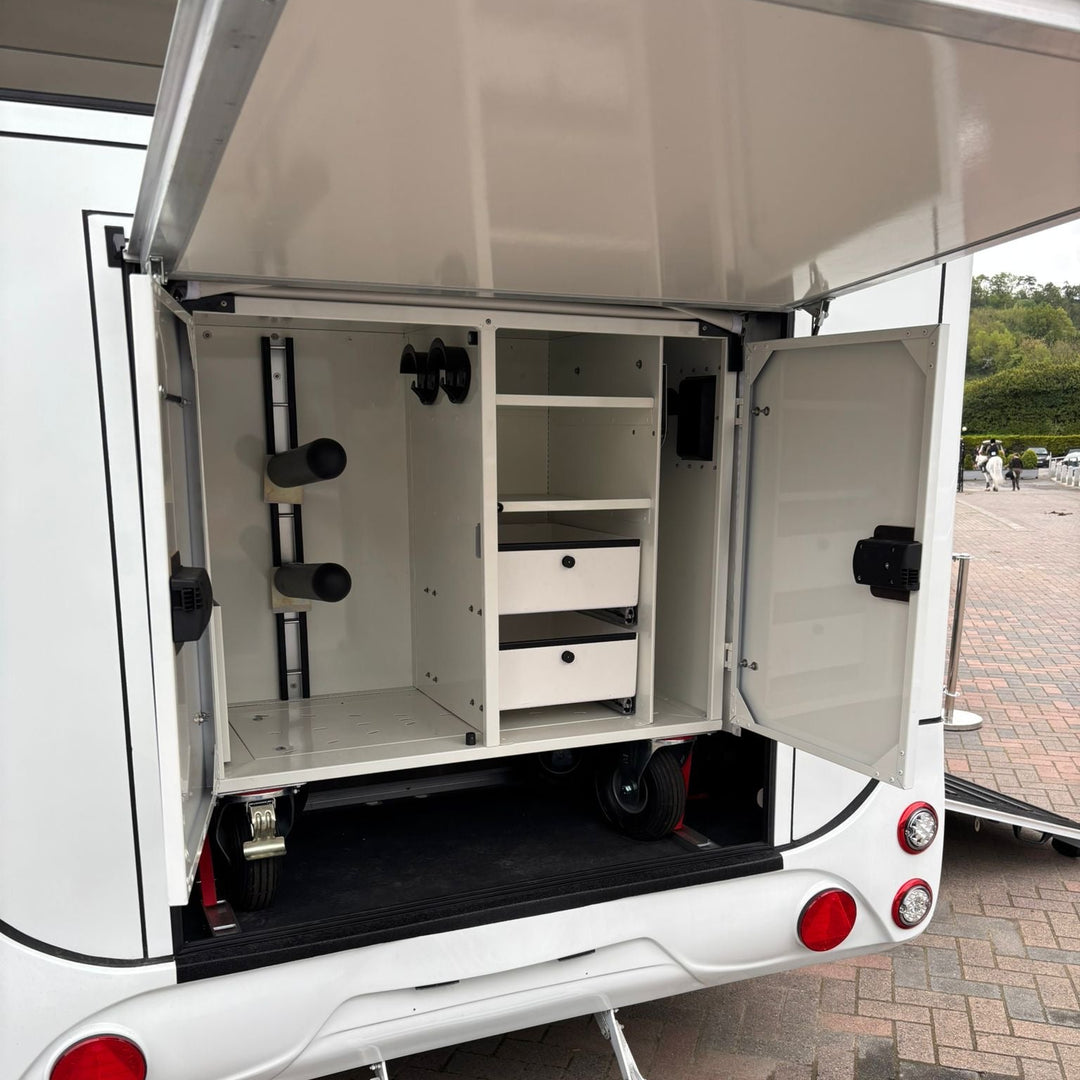 External rear tack locker open, fitted with saddle racks, bridle hooks and pull-out drawers