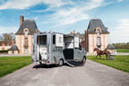 Front three-quarter view of a Theault Aero Master horsebox in a courtyard
