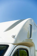 Close-up of the profiled over-cab luton pod on a Theault XTEO horsebox against a blue sky