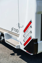 Rear corner of a Theault XTEO horsebox showing the XTEO badge and rear light cluster