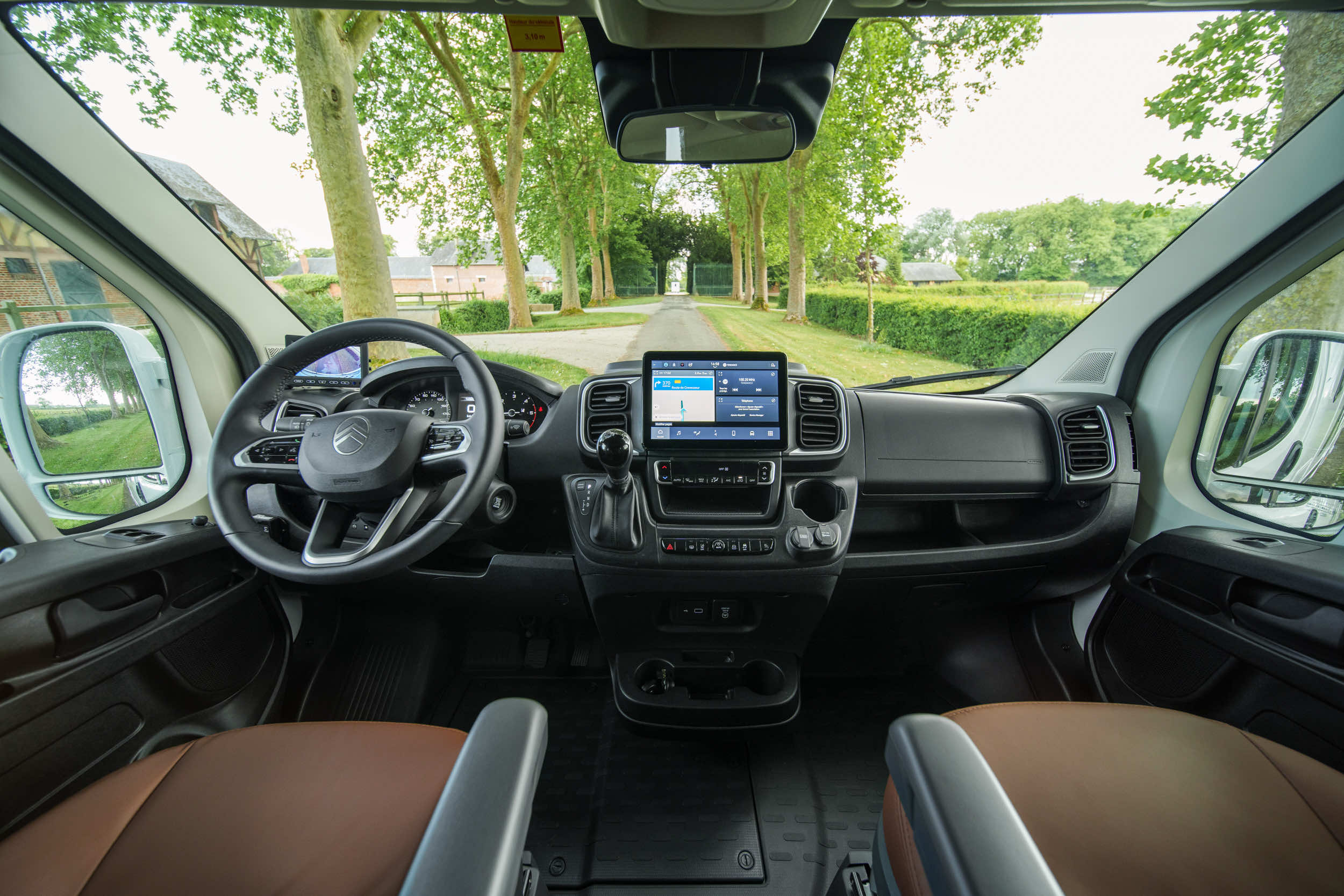 Cab interior of a Theault XTEO horsebox showing the dashboard, steering wheel and centre screen