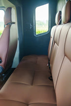 Upholstered seating and window in the forward compartment of a Theault XTEO horsebox
