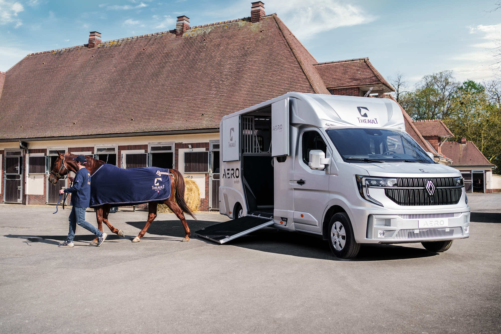 Theault Aero Master horsebox parked beside a stable with a horse alongside