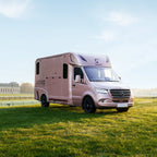 Front three-quarter view of a Theault Aero Sprinter horsebox in a field