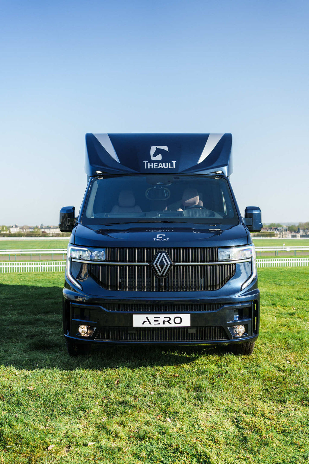 Head-on front view of a Theault Aero Master horsebox in a field